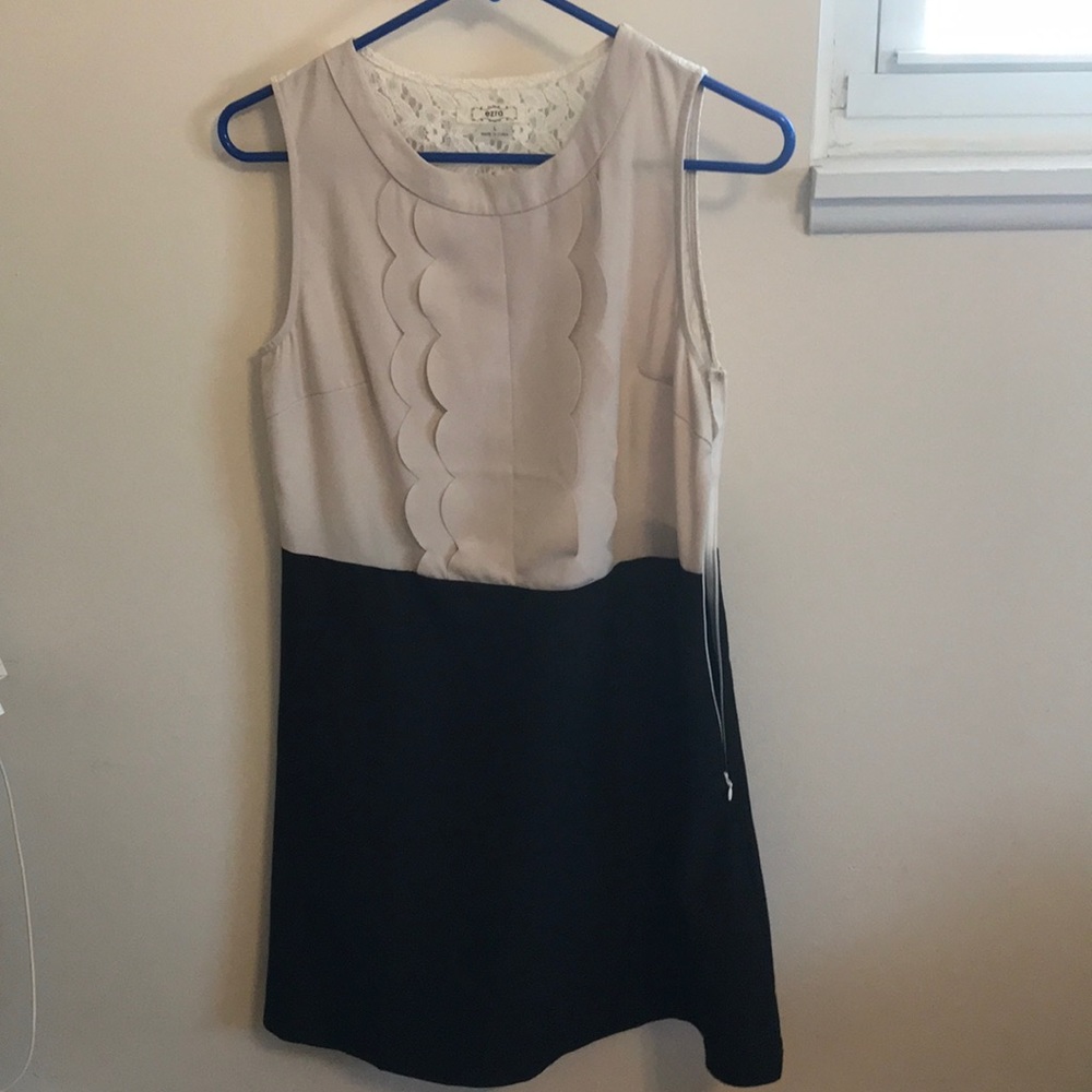 Cream and black cocktail dress.